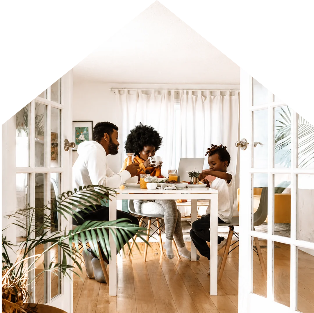 Family eating breakfast together at home